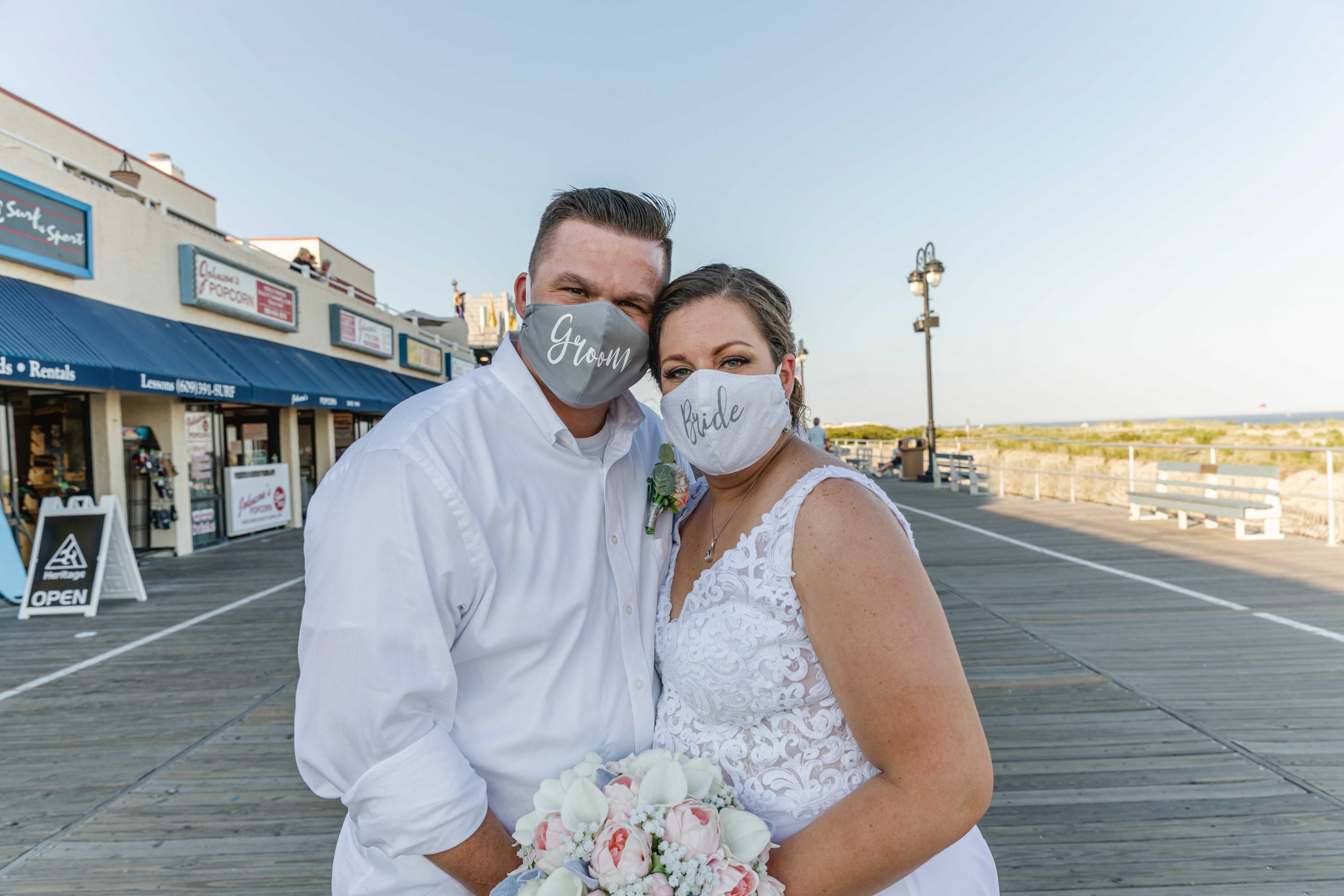 couple wearing wedding masks