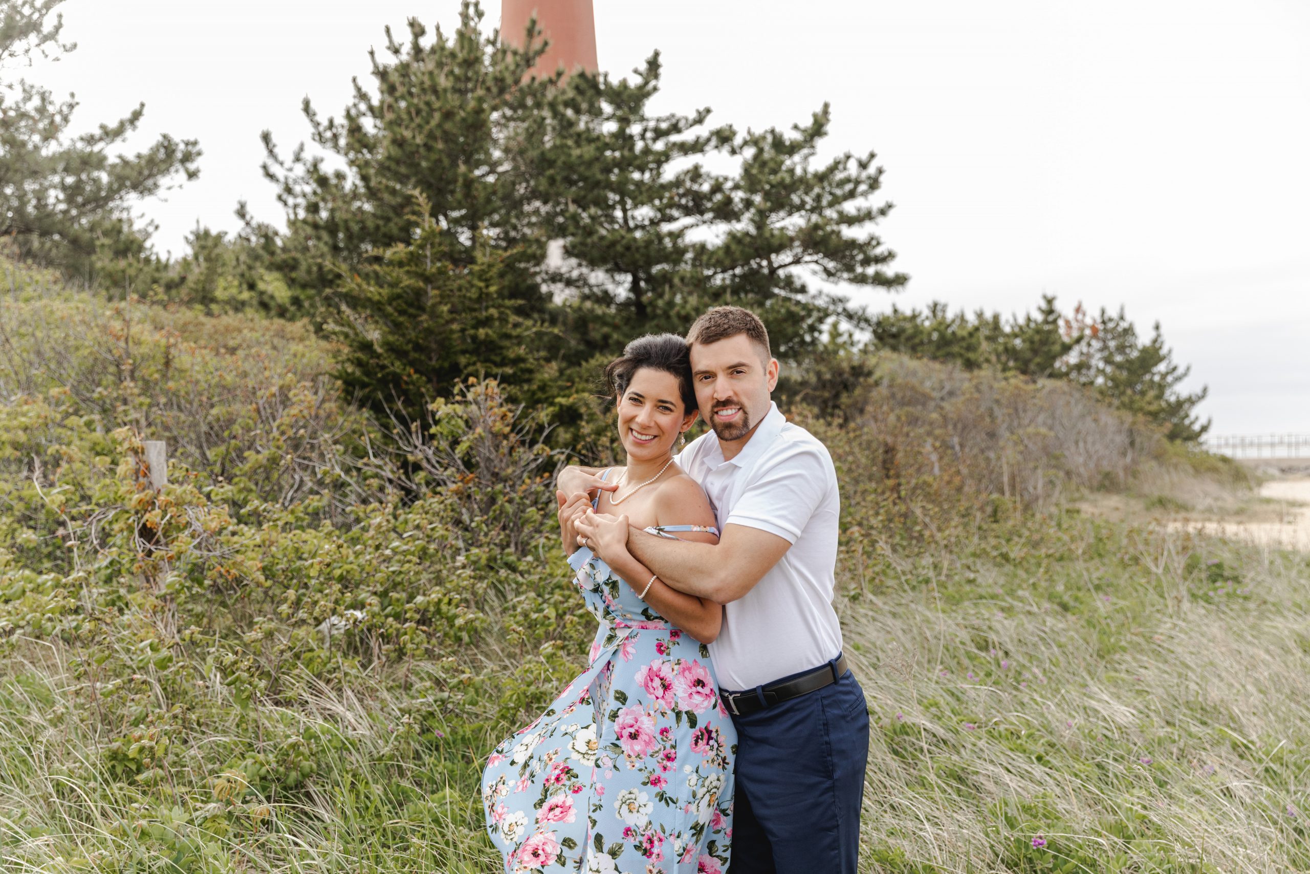 couple in front of lighthouse