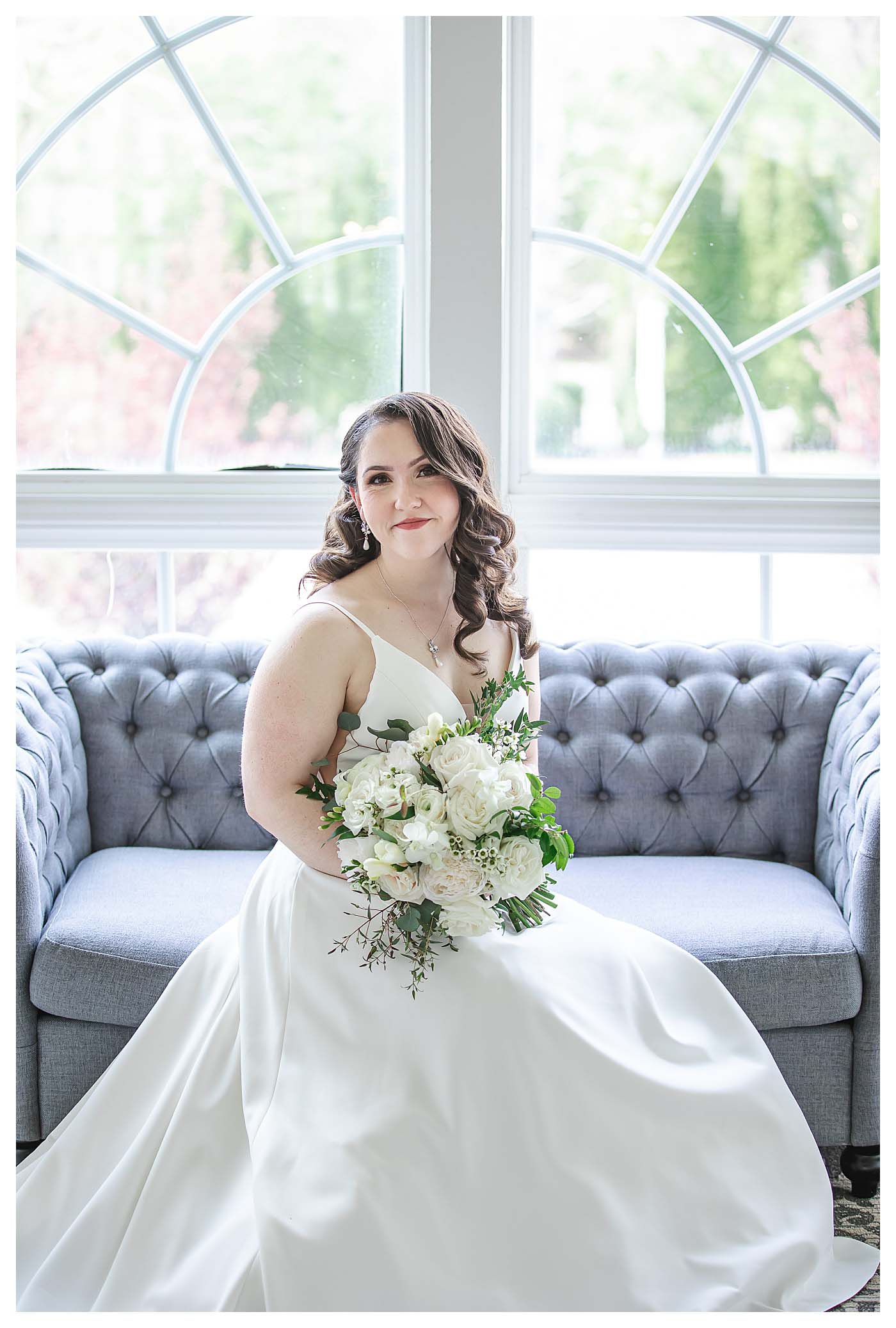bride sitting on blue couch