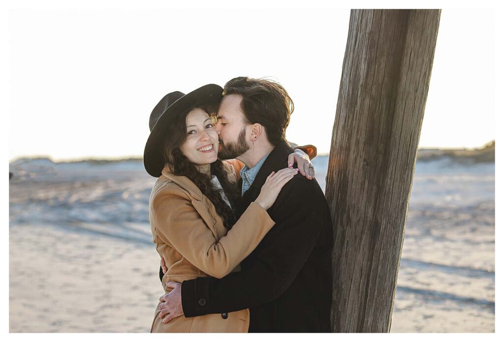 engagement couple kissing on beach Avalon Beach Engagement Session