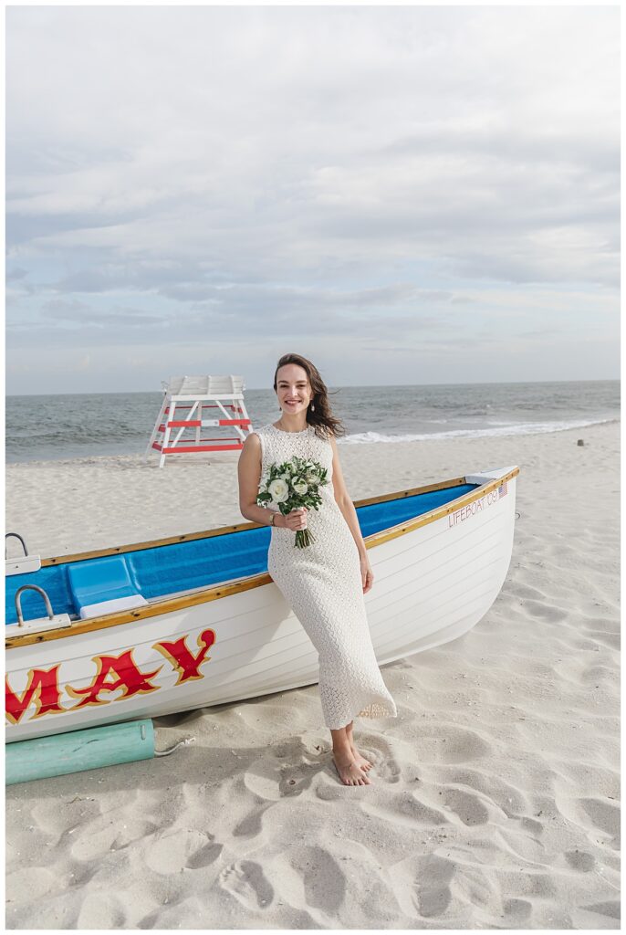 bride standing by cape may boat