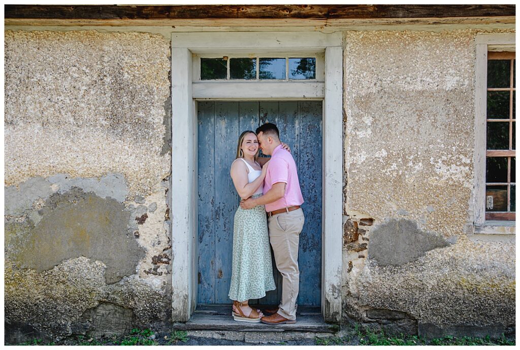 engaged couple posing at batsto village