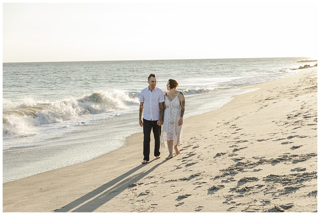 couple walking on beach in cape may