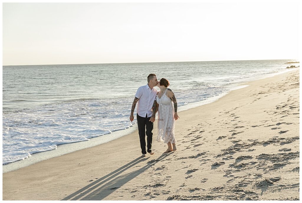couple walking on cape may beach