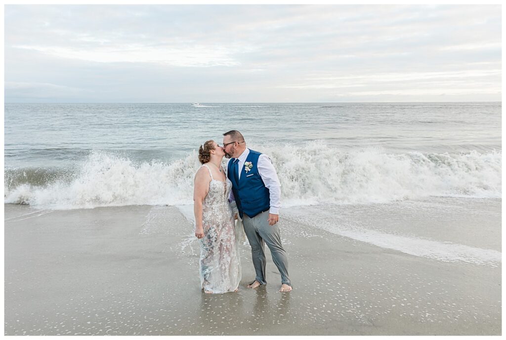 wedding couple kissing on beach