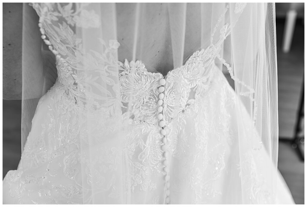 black and white photo of the back of Lauren's wedding gown