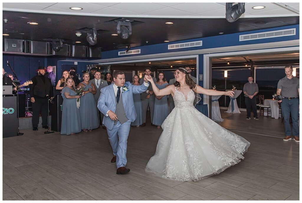 "Lauren and Zach sharing a magical first dance, surrounded by guests.