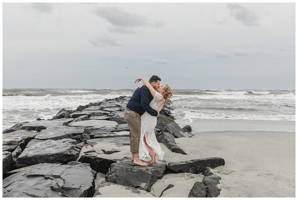 couple kissing on the rock jetty in ocean city