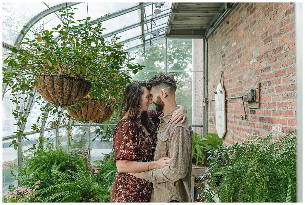 couple posing in greenhouse at smithville