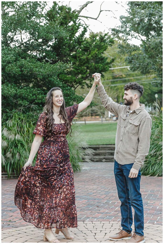 engaged couple dancing for photos