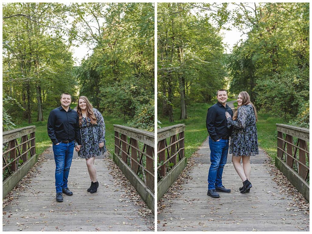 couple standing on wooden bridge for photos during engagment session