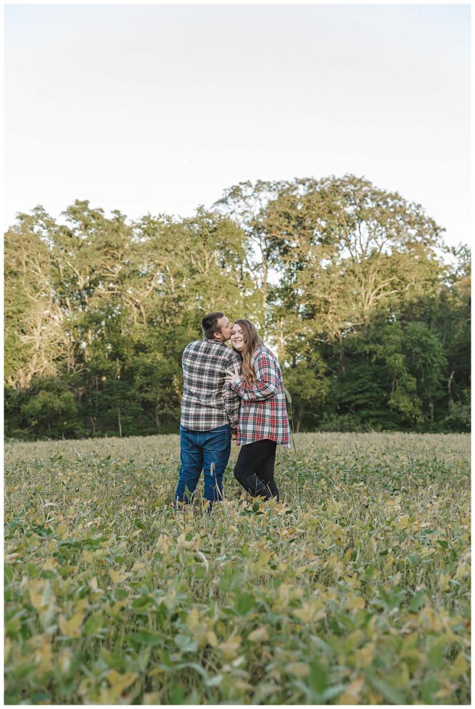 couple standing in field during photo session
