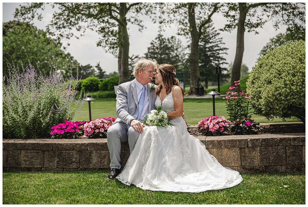 couple sitting for photos at the linwood county club in linwood nj