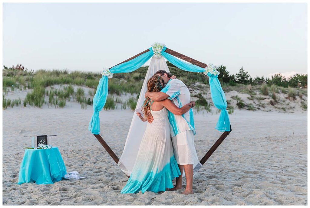 couple kissing on beach after they were married in Cape May NJ