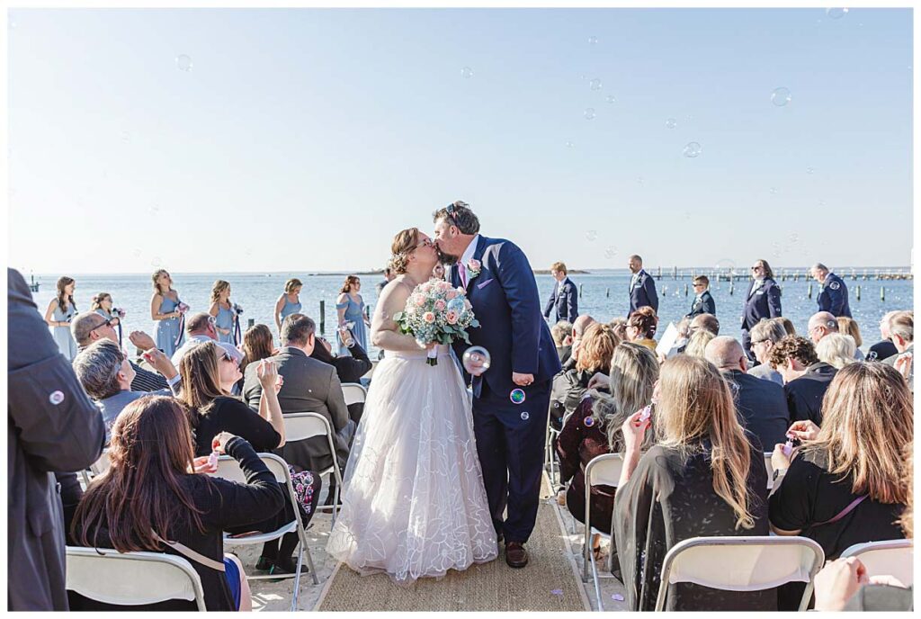 couple kissing after their ceremony at Brant beach yacht club