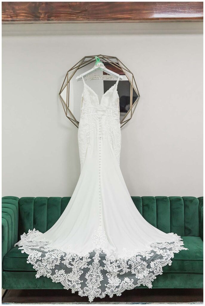 wedding dress on green couch