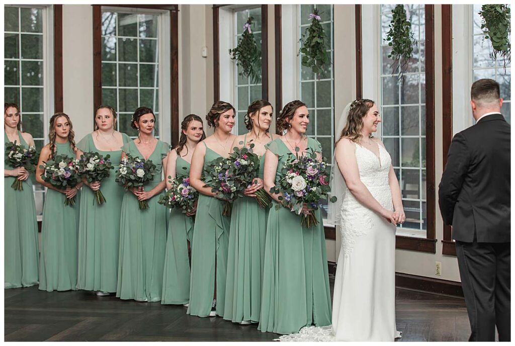 bride with bridesmaids during ceremony