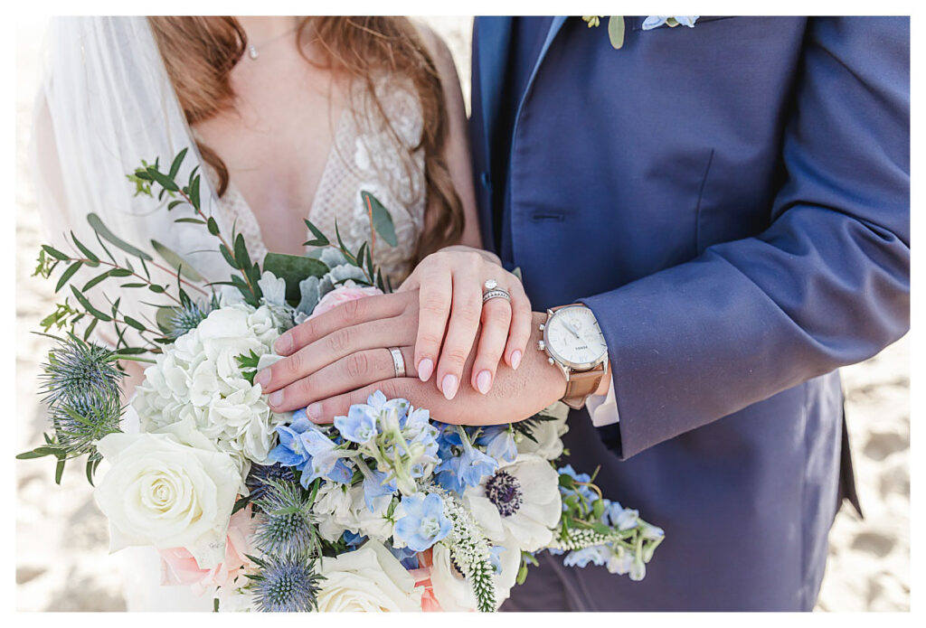 wedding rings on top of bouquet