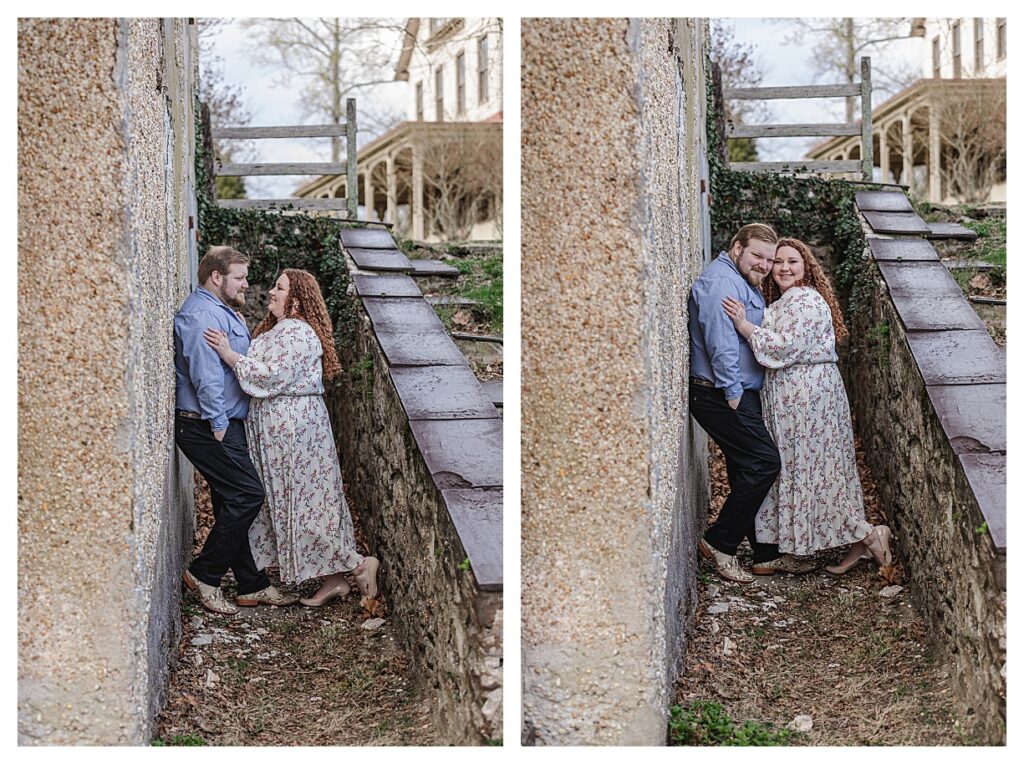 couple leaning against the wall getting their photo taken