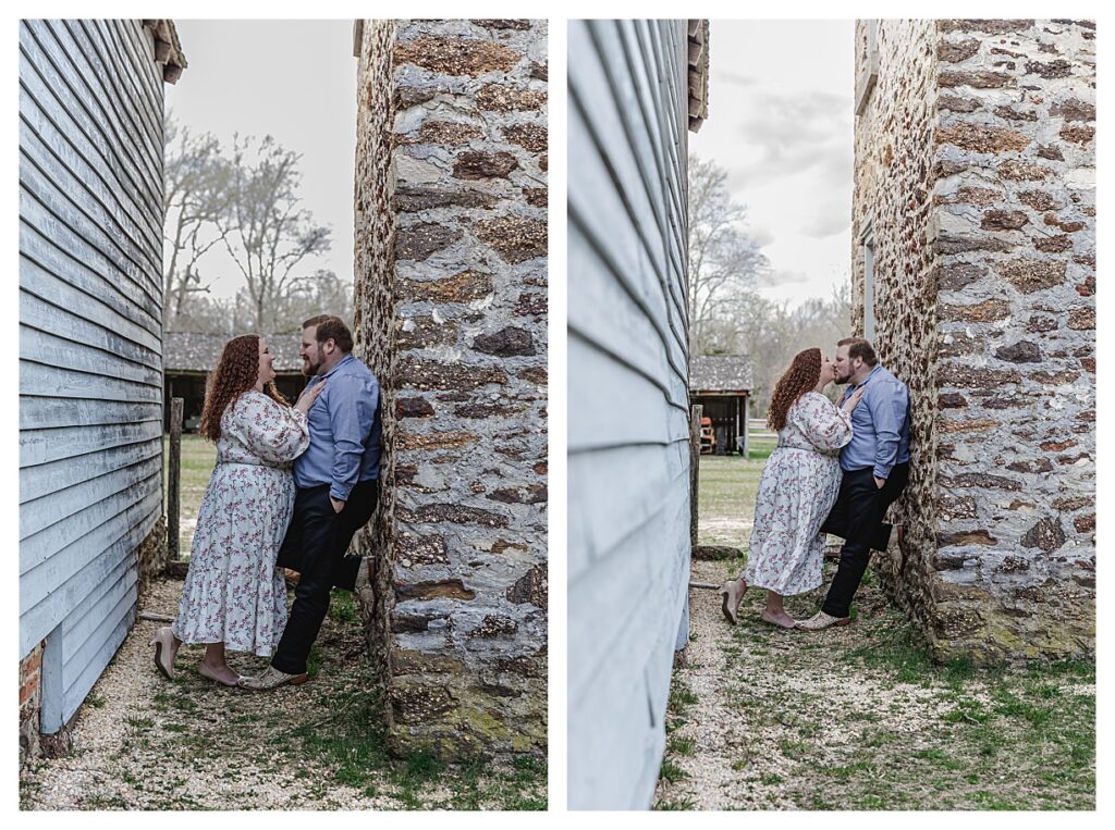 couple leaning against wall looking at each other