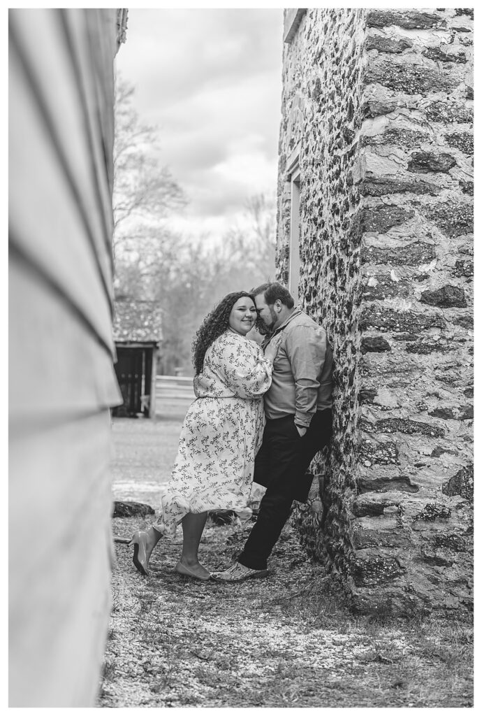 black and white of couple at their engagement session at batsto