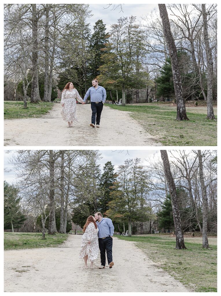 couple holding hands walking down a path during their engagement session