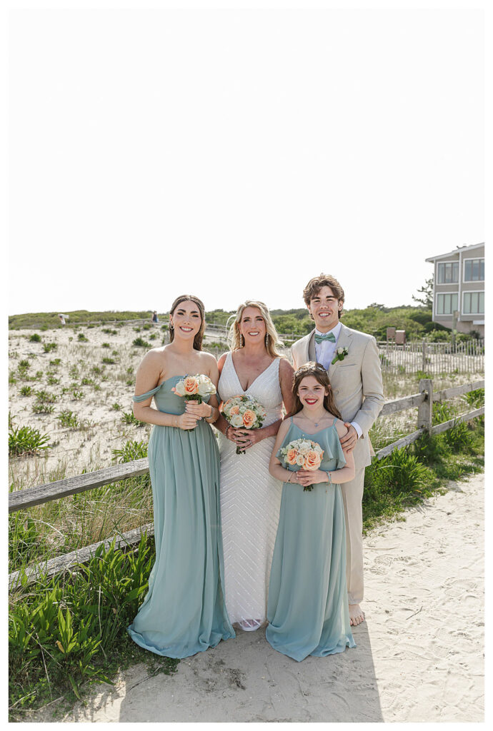 bride and wedding party on the beach in Ocean city nj