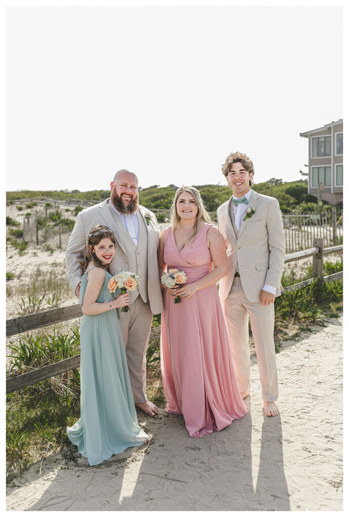 groom with wedding party on the beach in OCNJ