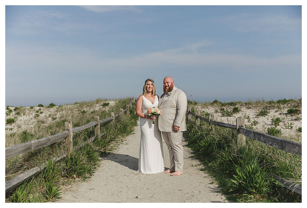 couple standing on the beach path in Ocean city nJ