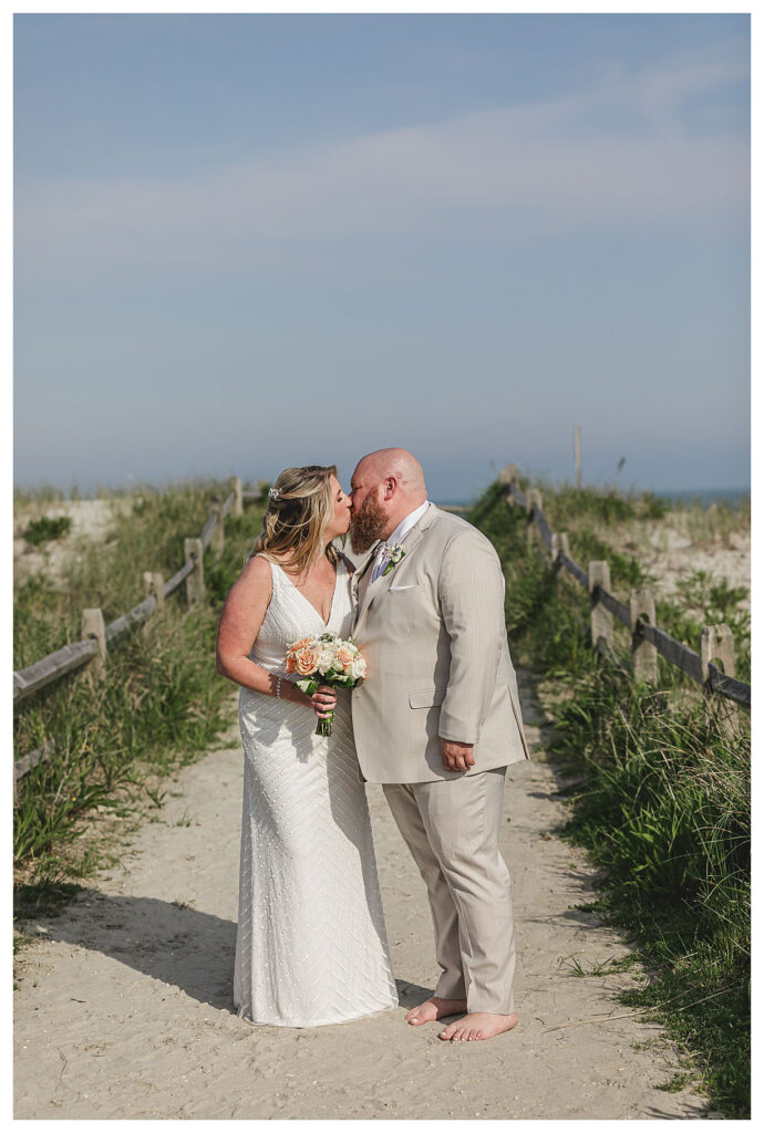 couple kissing on beach in Ocean city nj