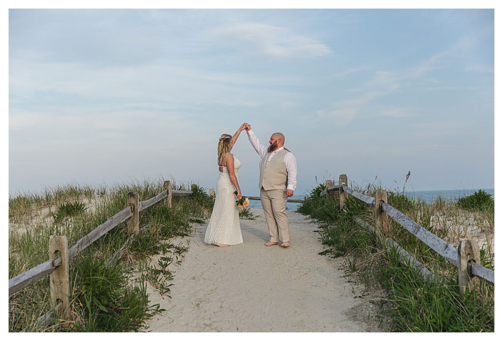 wedding couple dancing on beach path in OCNJ