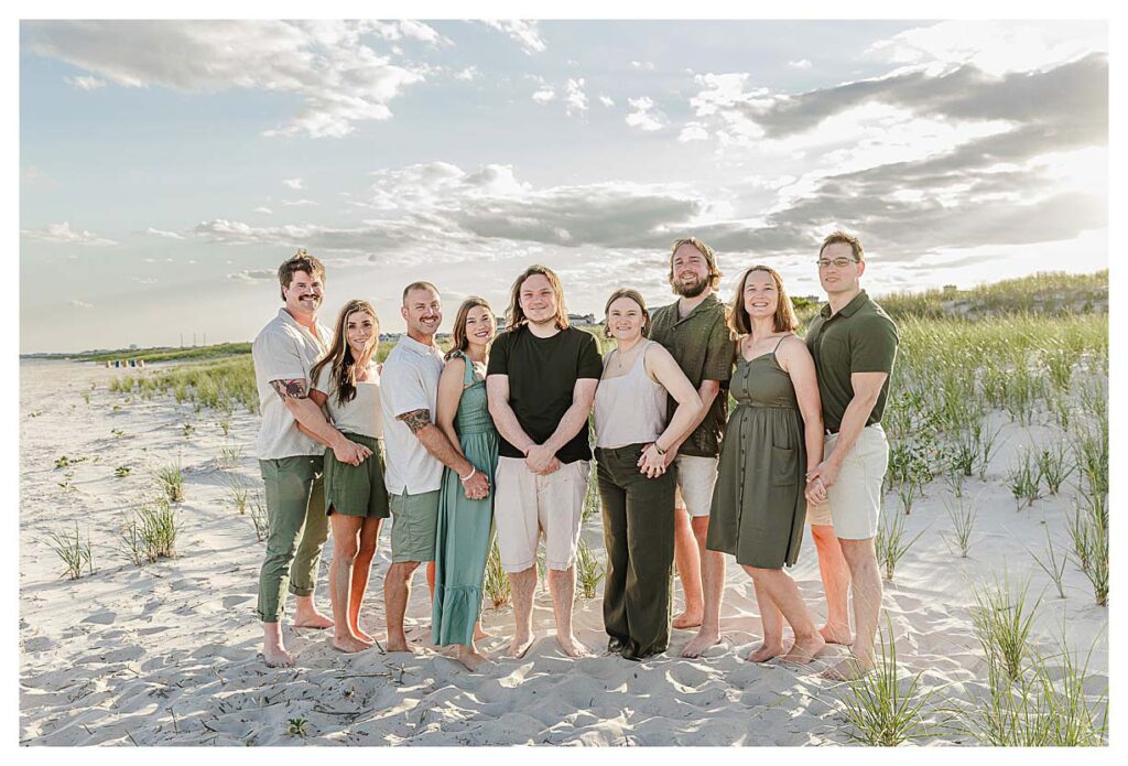 family on beach in ocean city all in shades of green and tan