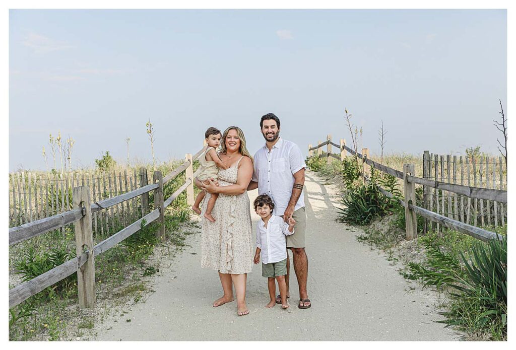 family standing on beach path getting their photo taken, south Jersey beach photography