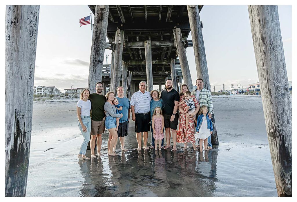 family standing under the pier in Ocean City nj for their family session