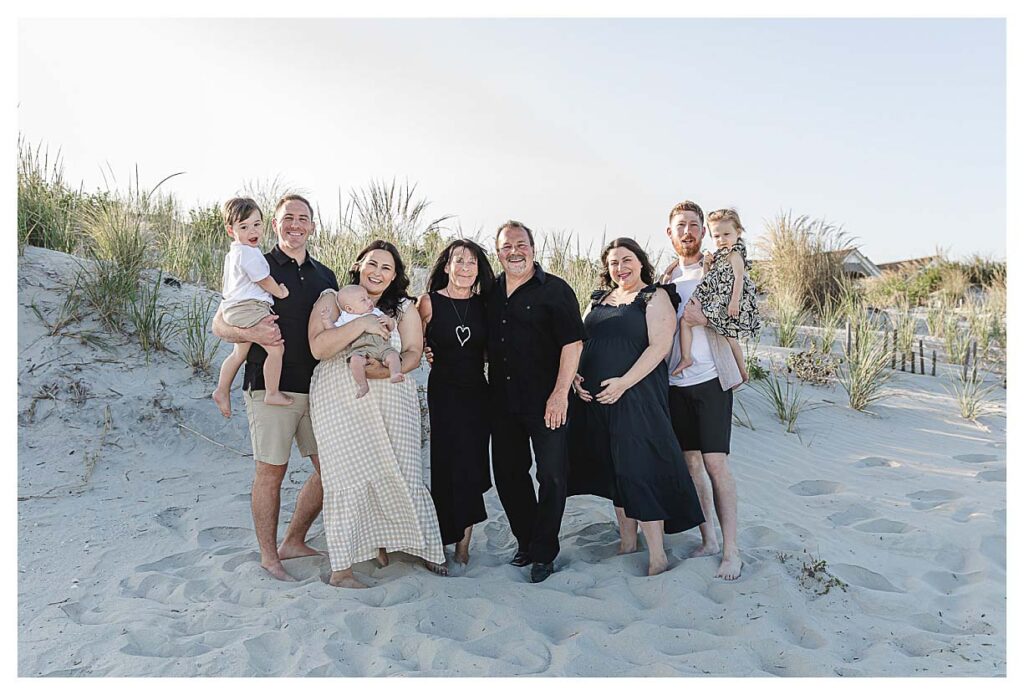 family wearing black and tan for their beach session in south jersey