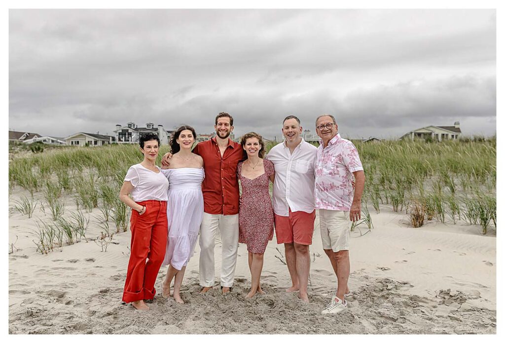 families wearing shades of red for their family session