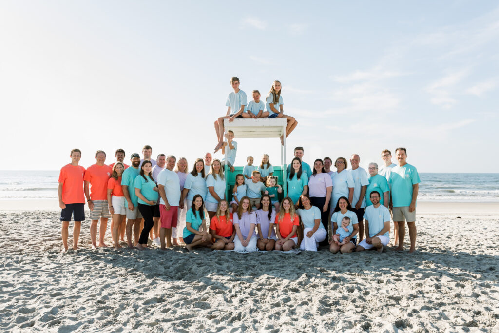 “Ocean City NJ family photographer beach session at sunrise with extended family”