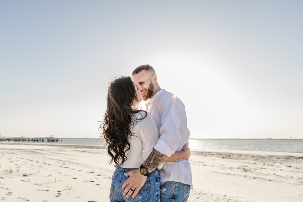 “Ocean City NJ engagement photographer couple walking on beach